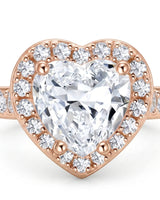 Luxury heart shaped moissanite ring with halo side stones in rose gold | SARATTI
