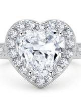 Luxury heart shaped moissanite ring with halo side stones in white gold | SARATTI