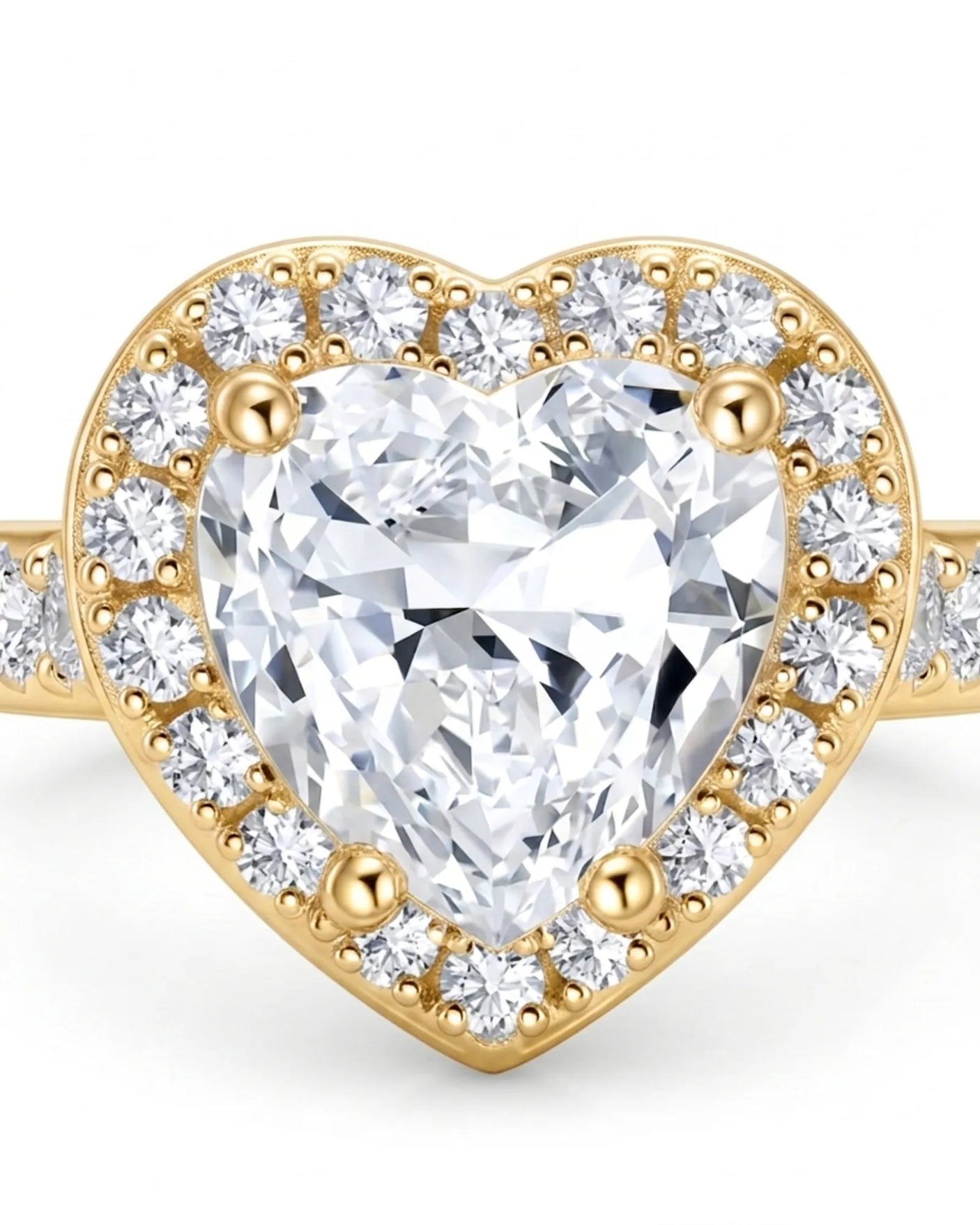 Luxury heart shaped moissanite ring with halo side stones in yellow gold | SARATTI
