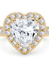 Luxury heart shaped moissanite ring with halo side stones in yellow gold | SARATTI