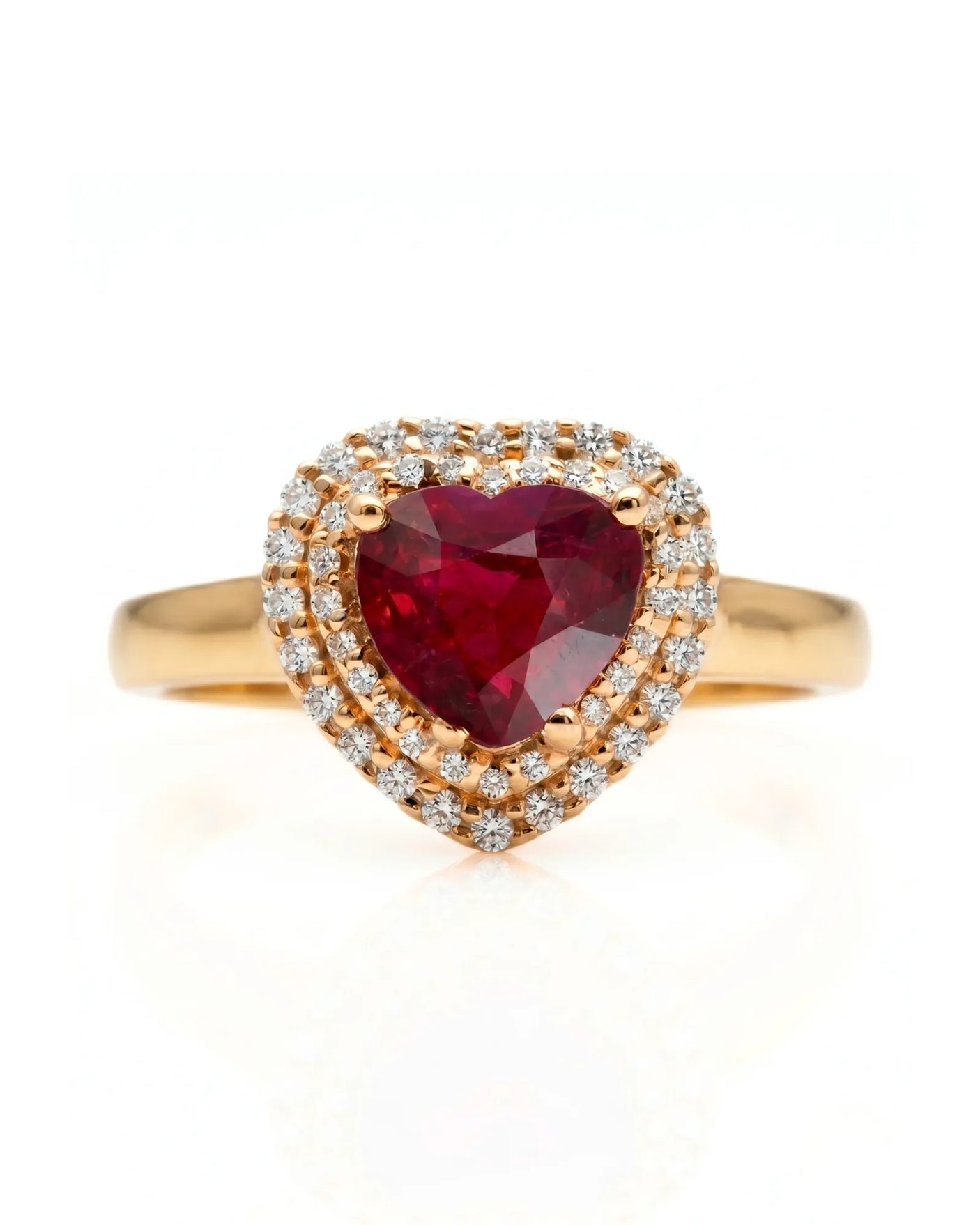 Luxury heart shaped ruby ring with double halo in refined yellow gold | SARATTI