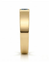 Luxury men’s ring with tension-set blue diamond and substantial 18K yellow gold profile - SARATTI