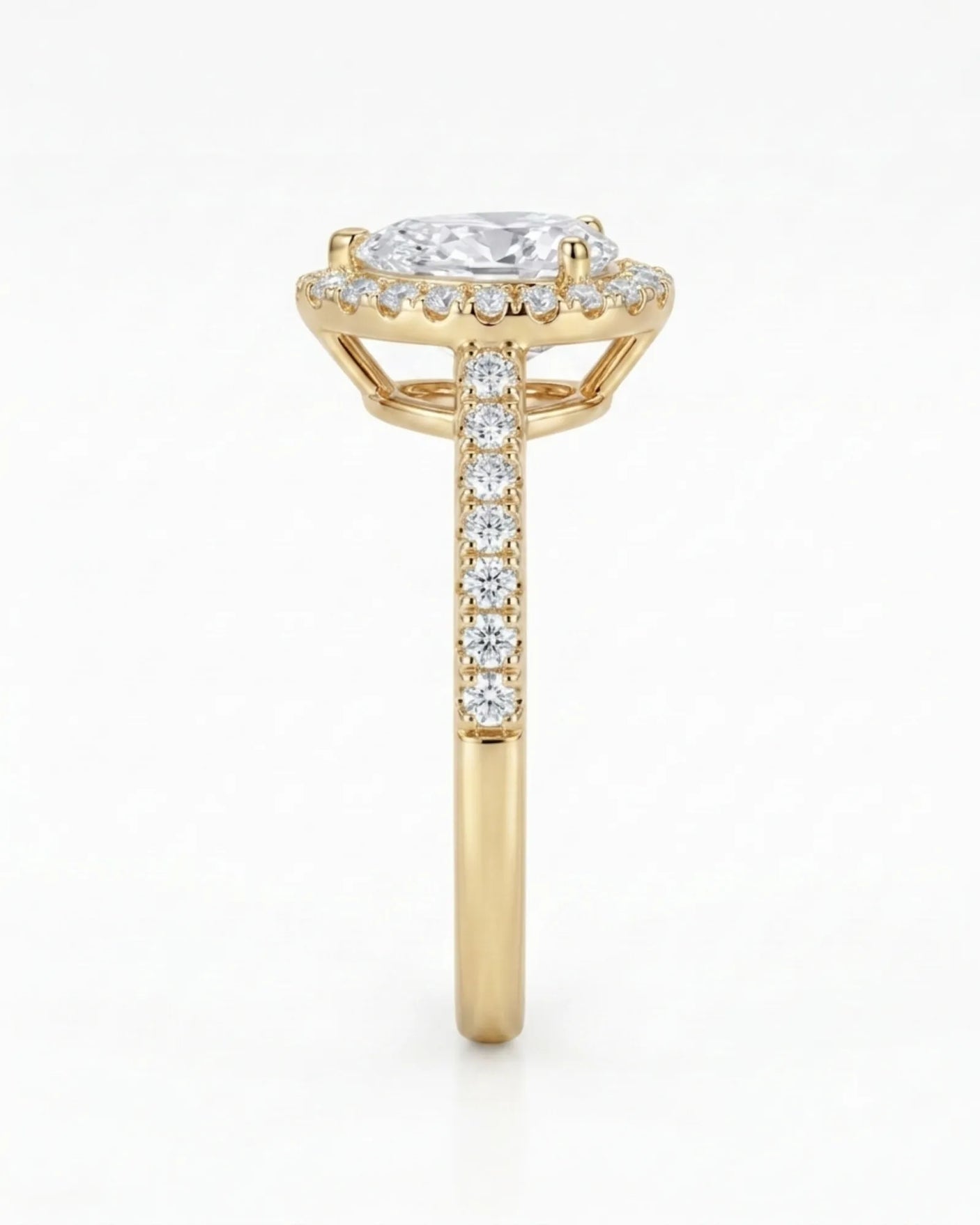 Luxury moissanite engagement ring featuring a pear center and luminous halo in yellow gold - SARATTI