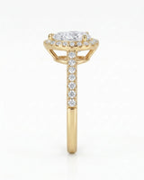 Luxury moissanite engagement ring featuring a pear center and luminous halo in yellow gold - SARATTI