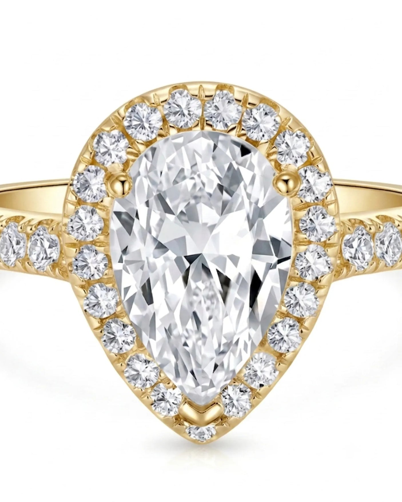 Luxury moissanite engagement ring featuring a pear center and luminous halo in yellow gold | SARATTI