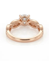 Luxury moissanite solitaire ring with interwoven pavé detailing and 18K rose gold craftsmanship - SARATTI