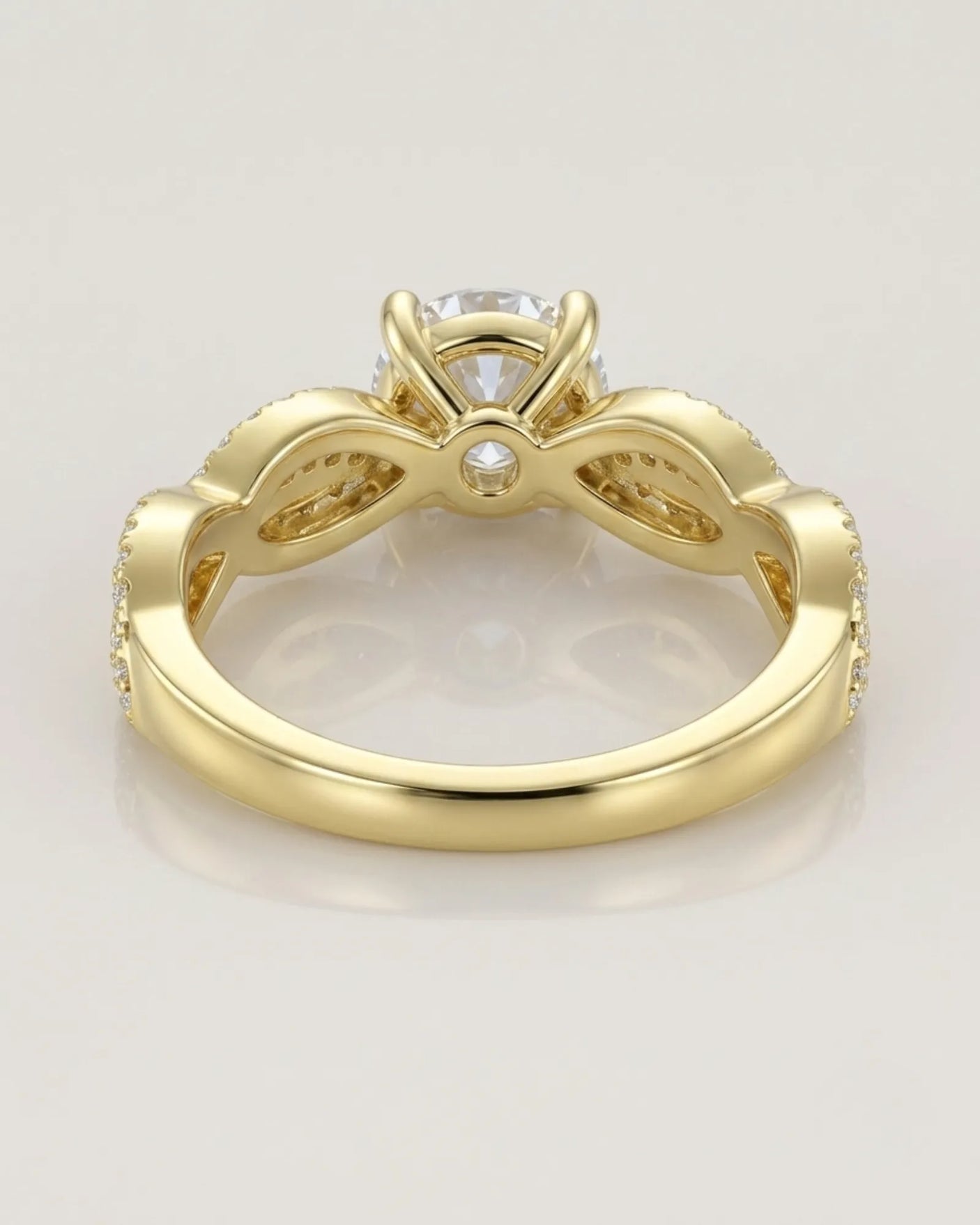 Luxury moissanite solitaire ring with interwoven pavé detailing and 18K yellow gold craftsmanship - SARATTI