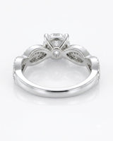 Luxury moissanite solitaire ring with interwoven pavé detailing and enduring platinum craftsmanship | SARATTI