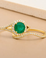 Luxury natural emerald bridal set with moissanite split-shank detailing in yellow gold | SARATTI.