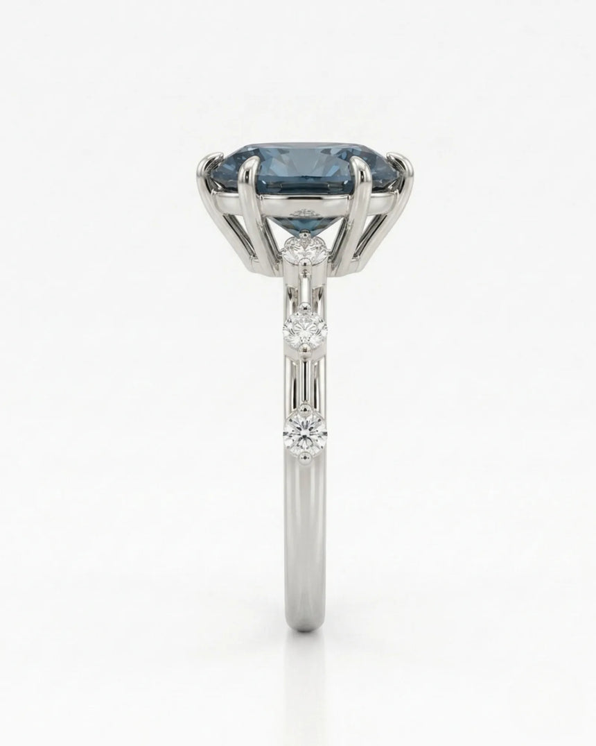 Luxury oval blue moissanite ring with accent stones and polished white gold finish | SARATTI