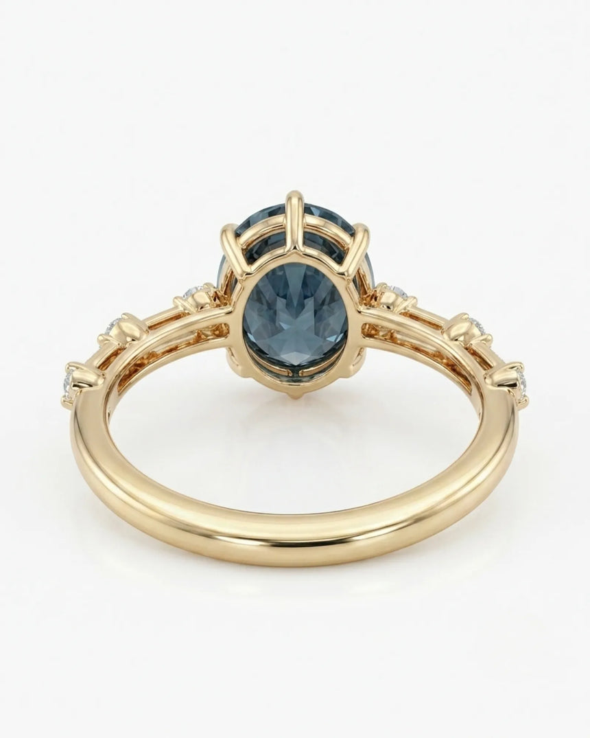 Luxury oval blue moissanite ring with accent stones and rich yellow gold finish - SARATTI