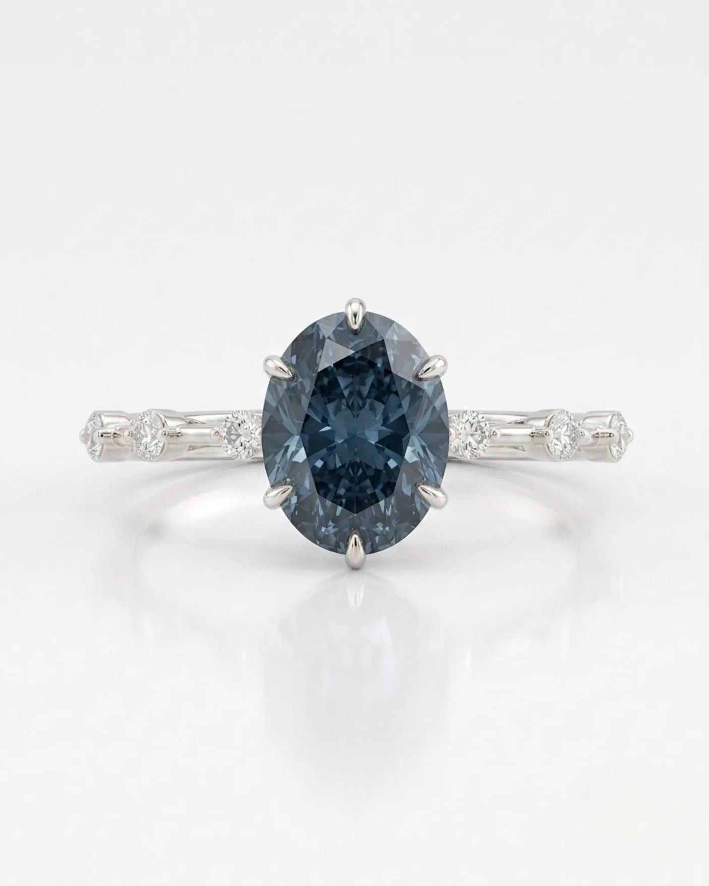 Luxury oval blue moissanite ring with accent stones and timeless platinum finish | SARATTI