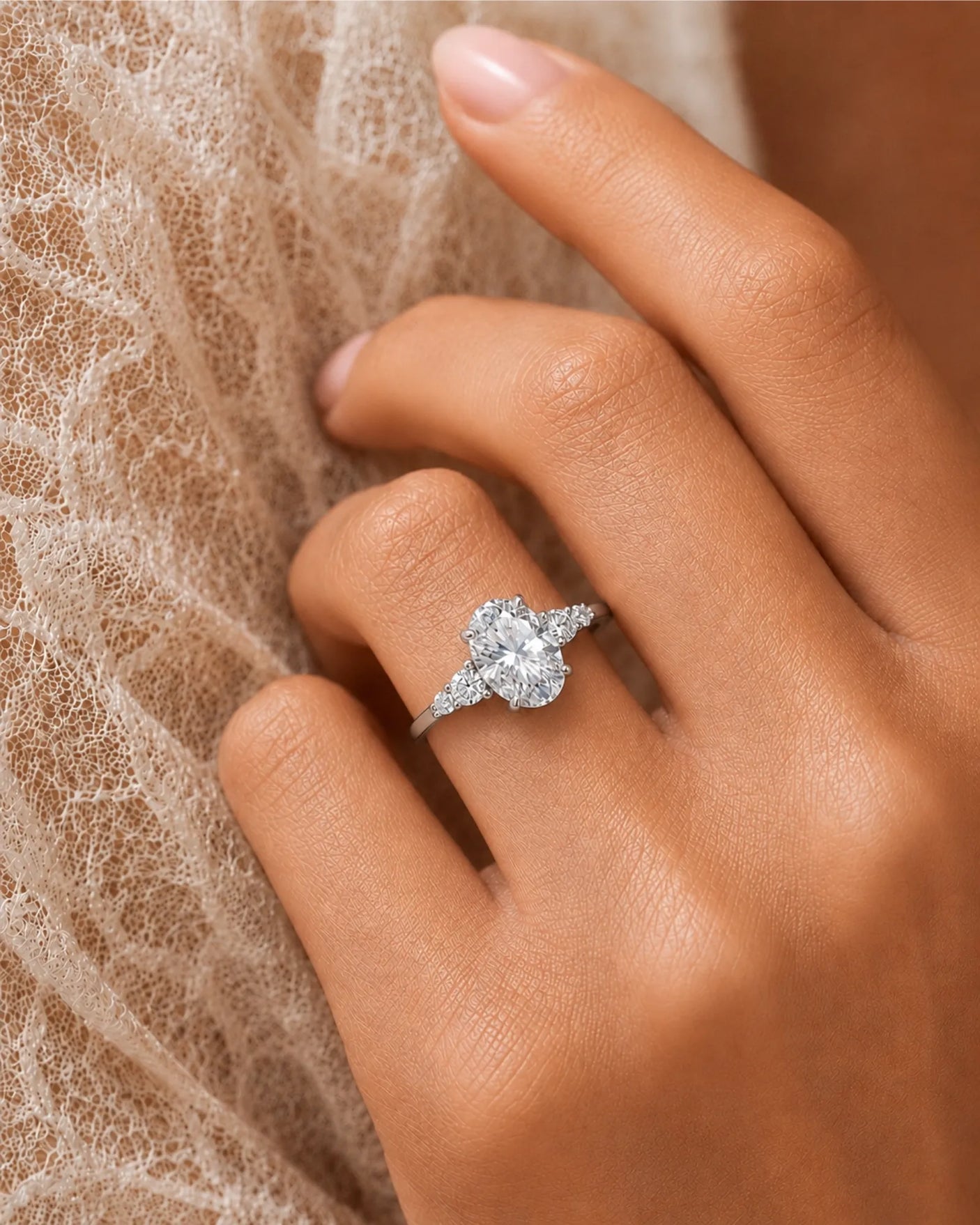 Luxury oval diamond ring with graduated side stones and bespoke platinum craftsmanship - SARATTI