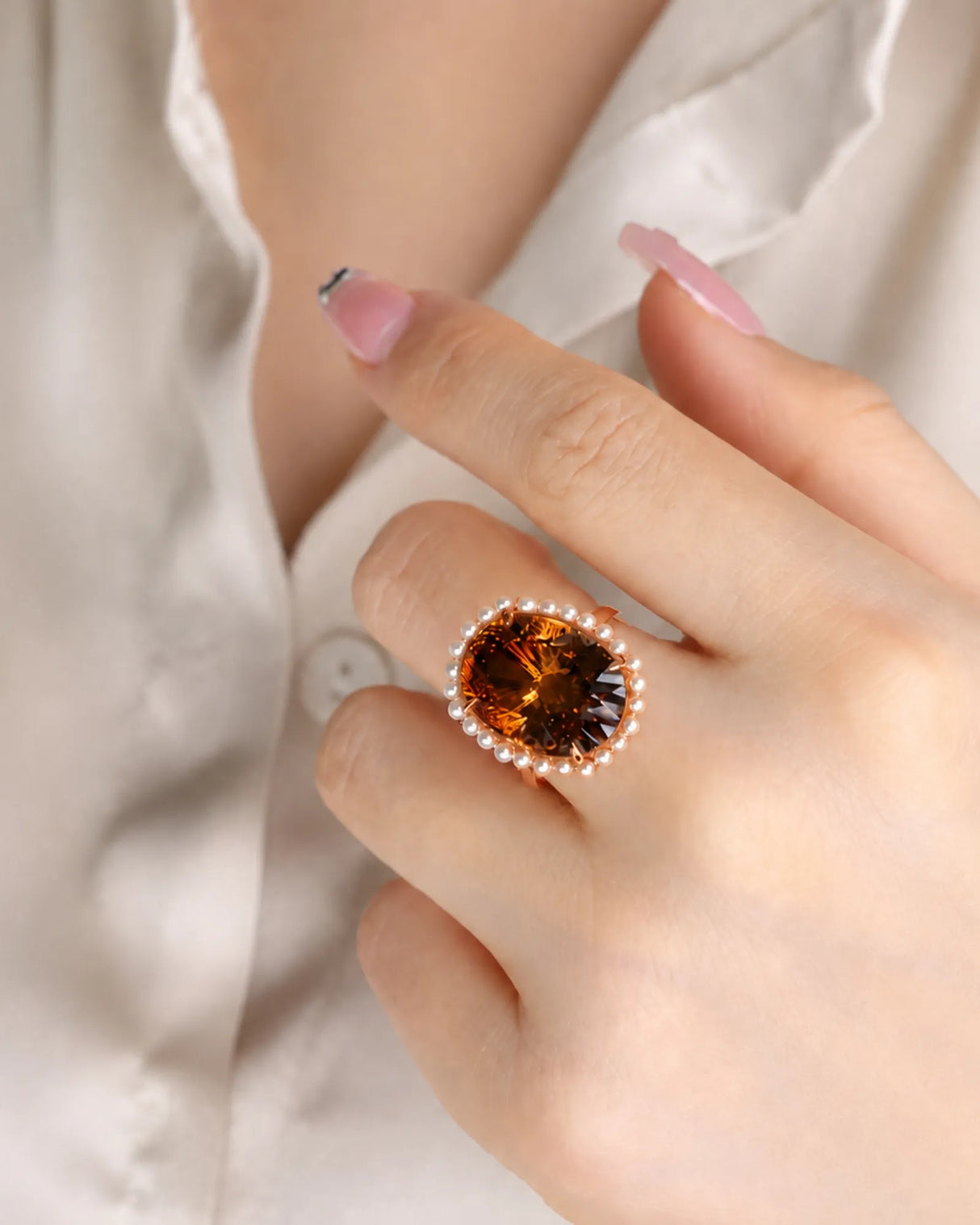 Luxury oval gemstone ring pairing natural Imperial Topaz, pearls, and premium 18K rose gold | SARATTI