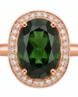 Luxury oval green tourmaline ring with diamond halo in 18K rose gold | SARATTI
