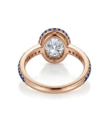 Luxury oval moissanite and natural sapphire ring with protective bezel in 18K rose gold - SARATTI