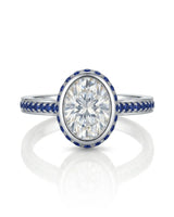 Luxury oval moissanite and natural sapphire ring with protective bezel in polished platinum - SARATTI