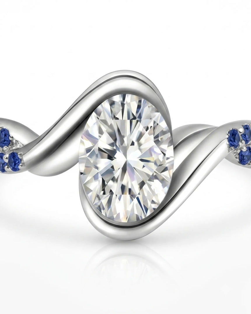 Luxury oval moissanite and natural sapphire ring with sculptural platinum ribbon setting | SARATTI.