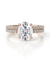 Luxury oval moissanite bridal set with matching pavé bands and refined 18K rose gold craftsmanship | SARATTI