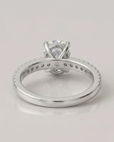 Luxury oval moissanite bridal set with matching pavé bands and refined 18K white gold craftsmanship - SARATTI