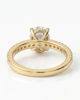 Luxury oval moissanite bridal set with matching pavé bands and rich 18K yellow gold craftsmanship - SARATTI