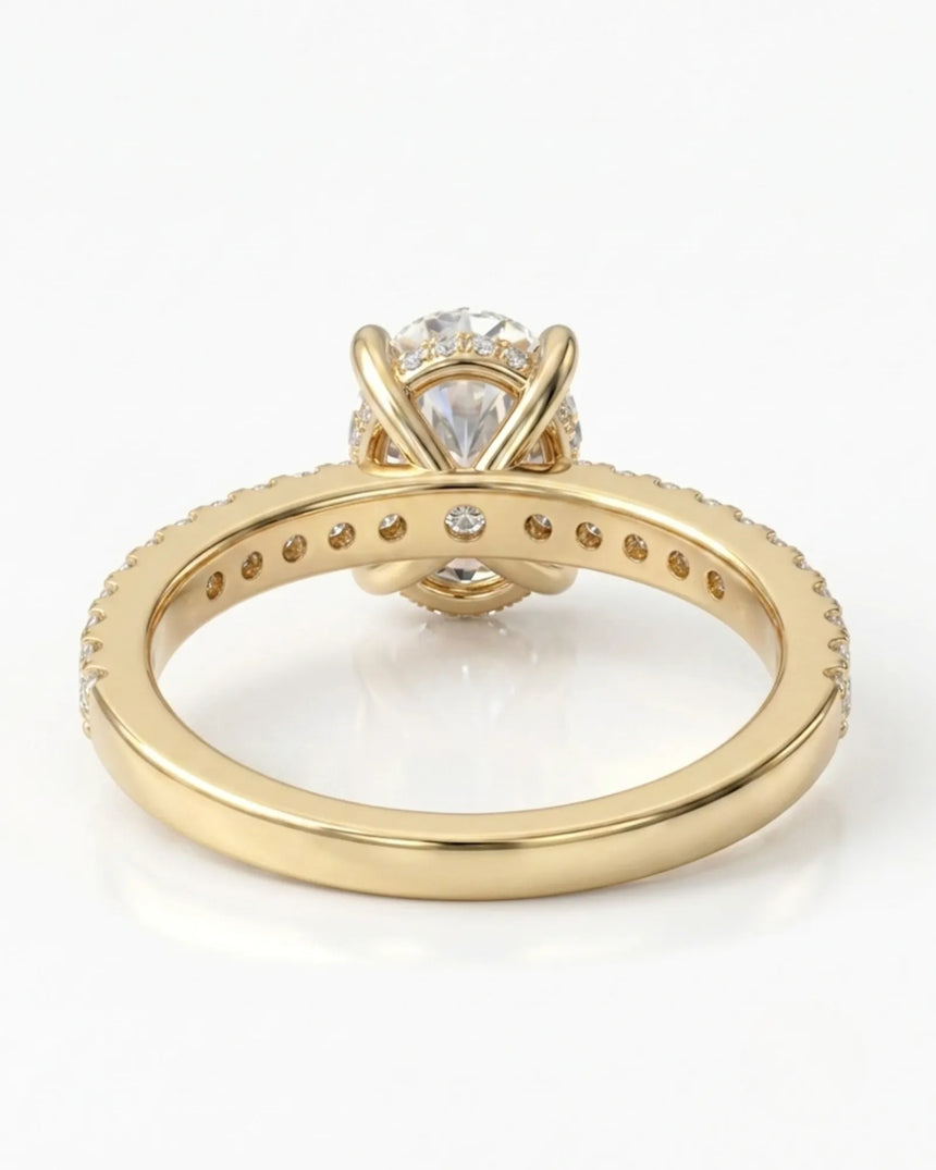 Luxury oval moissanite bridal set with matching pavé bands and rich 18K yellow gold craftsmanship - SARATTI
