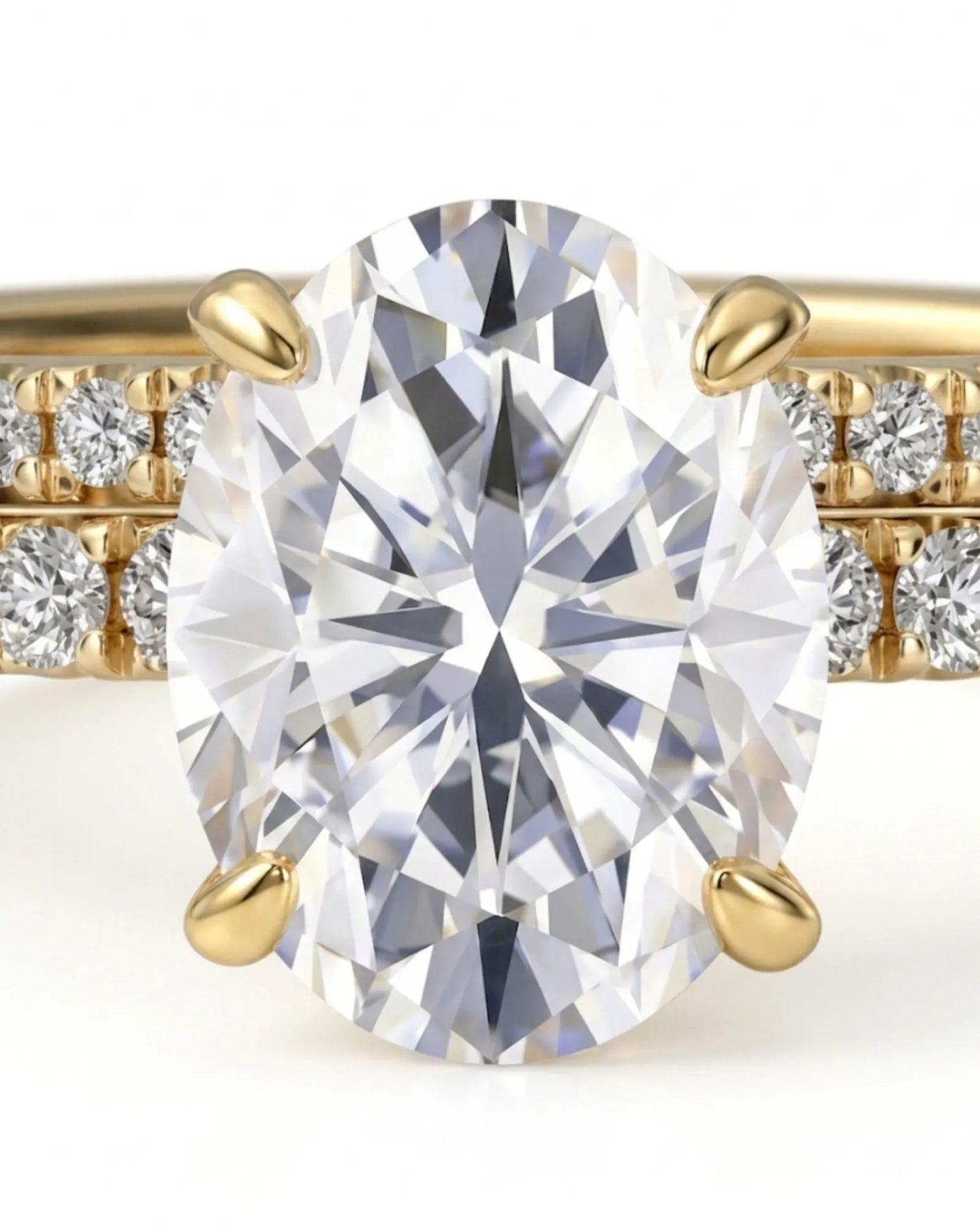 Luxury oval moissanite bridal set with matching pavé bands and rich 18K yellow gold craftsmanship | SARATTI