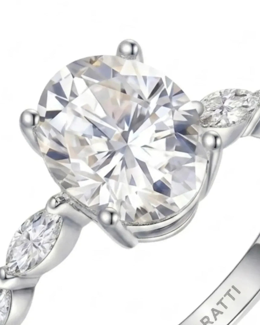 Luxury oval moissanite engagement ring with royal marquise detailing and 18K white gold craftsmanship | SARATTI