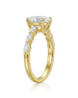 Luxury oval moissanite engagement ring with royal marquise detailing and 18K yellow gold craftsmanship -- SARATTI