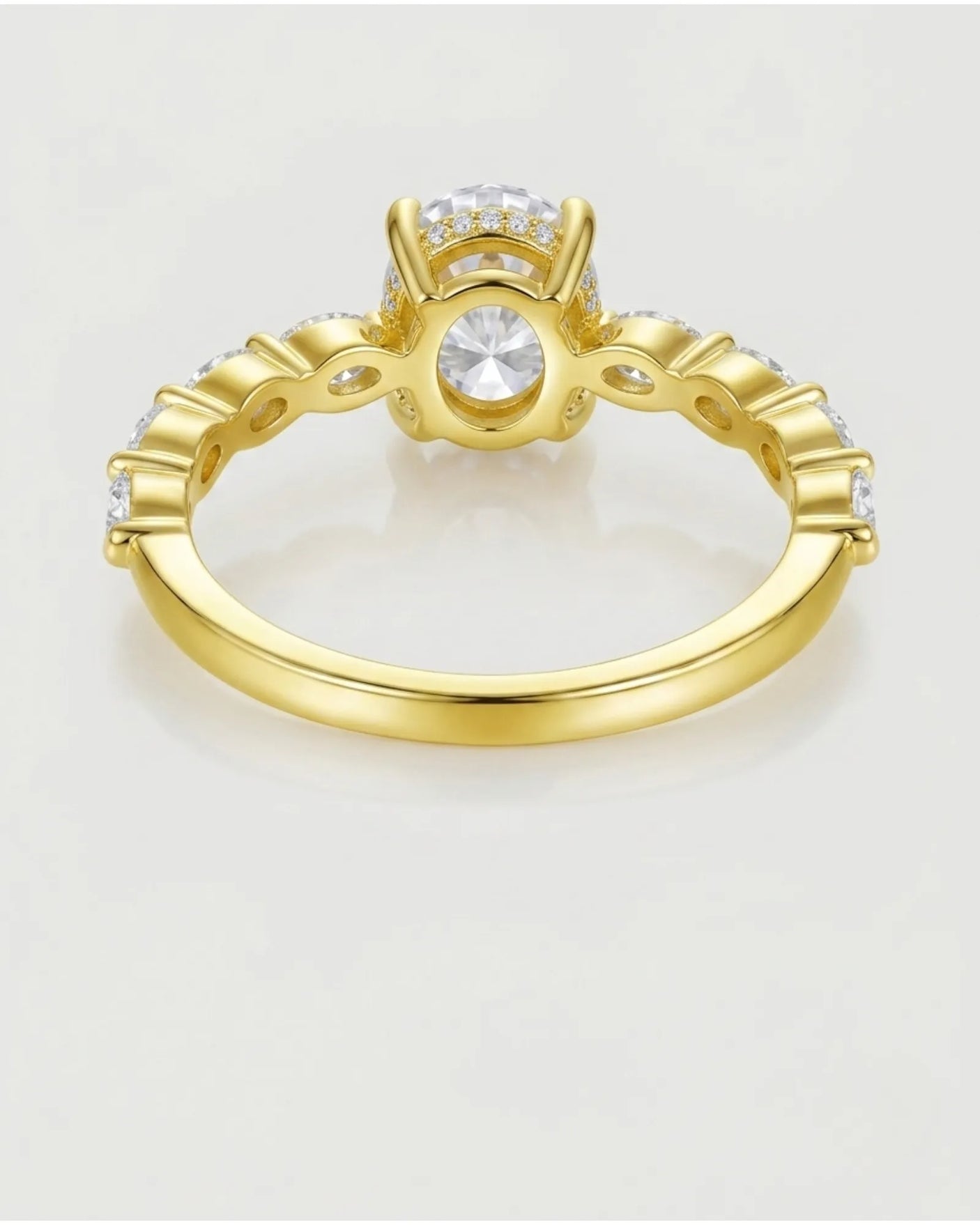 Luxury oval moissanite engagement ring with royal marquise detailing and 18K yellow gold craftsmanship | SARATTI