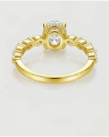 Luxury oval moissanite engagement ring with royal marquise detailing and 18K yellow gold craftsmanship | SARATTI