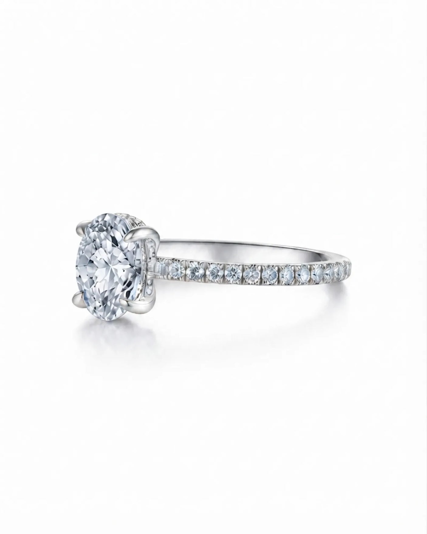 Luxury oval moissanite pavé engagement ring with an elevated platinum profile | SARATTI