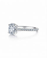 Luxury oval moissanite pavé engagement ring with an elevated platinum profile | SARATTI