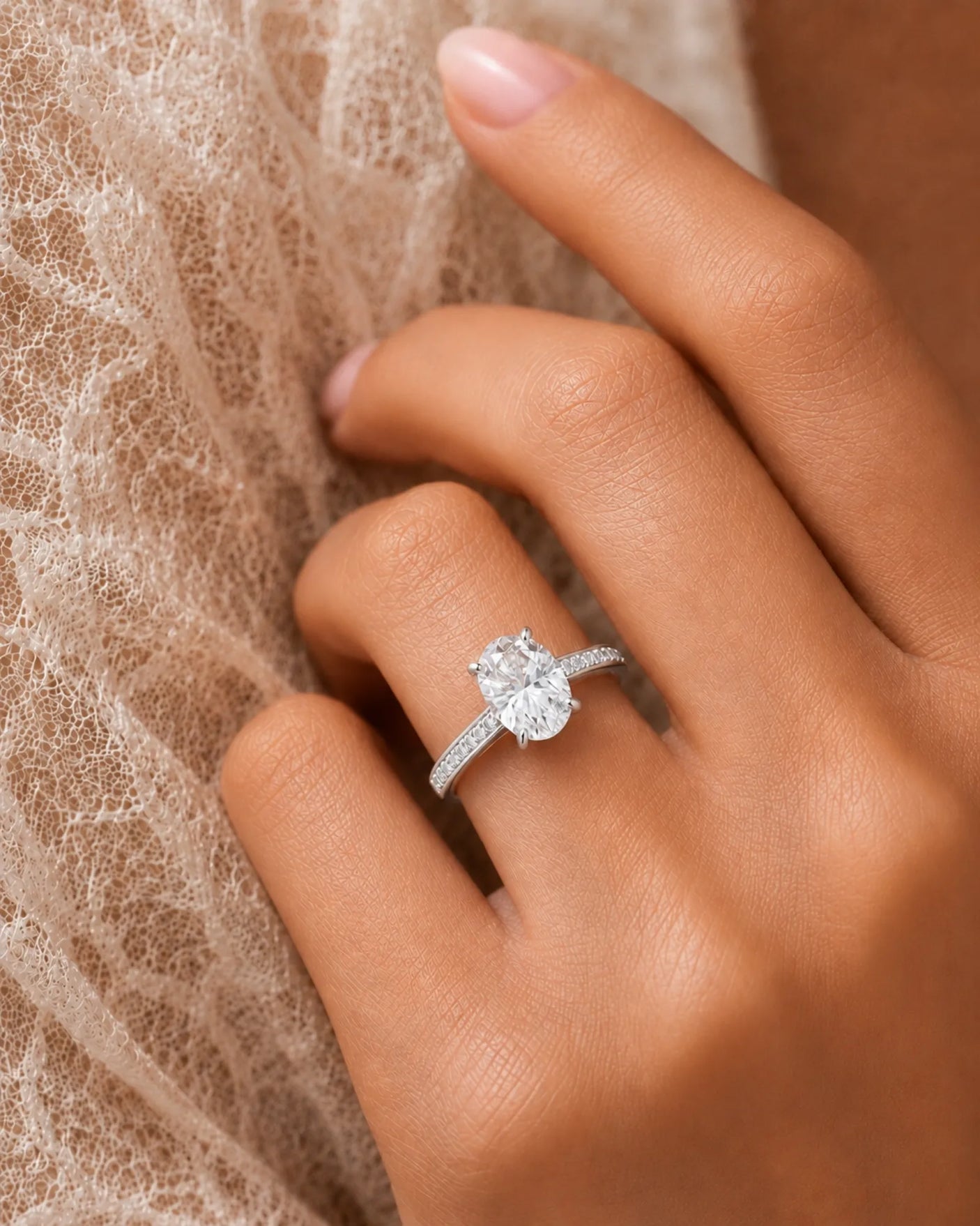 Luxury oval moissanite ring with brilliant pavé shoulders and timeless platinum setting | SARATTI