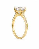 Luxury oval moissanite ring with brilliant pavé shoulders and yellow gold setting | SARATTI