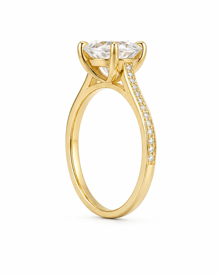 Luxury oval moissanite ring with brilliant pavé shoulders and yellow gold setting | SARATTI