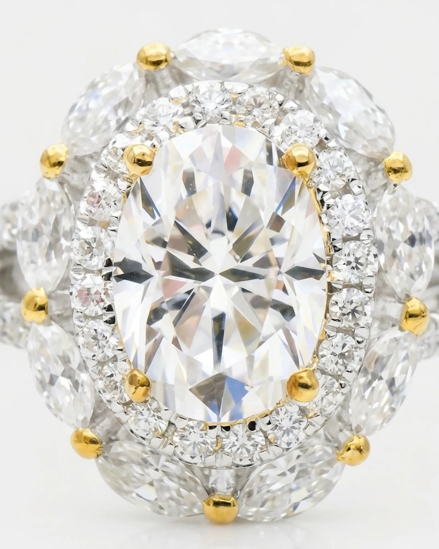 Luxury oval moissanite ring with floral halo and pavé split shan in two tone | SARATTI