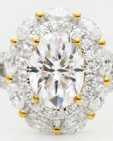 Luxury oval moissanite ring with floral halo and pavé split shan in two tone | SARATTI