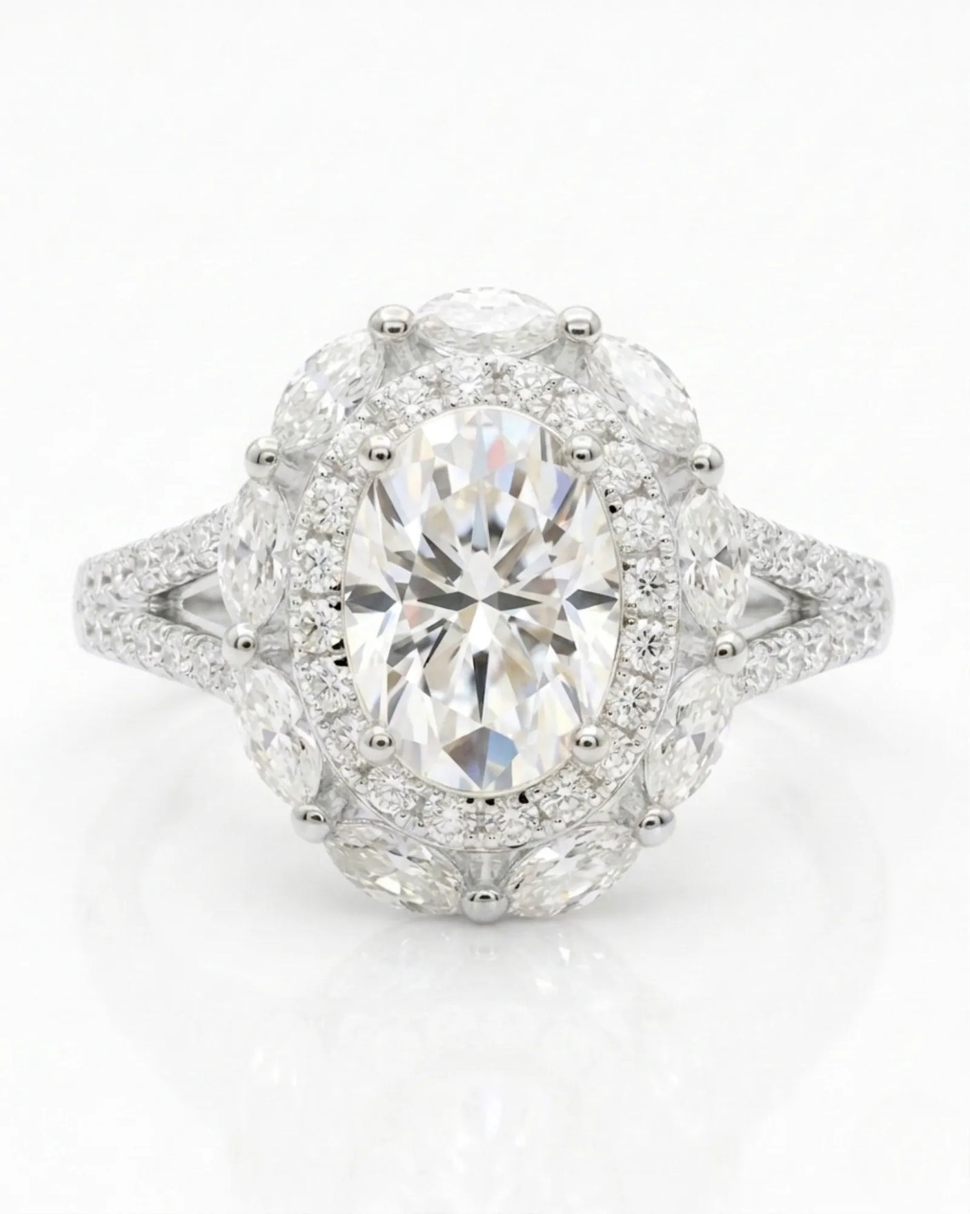 Luxury oval moissanite ring with floral halo and pavé split shank in white gold | SARATTI