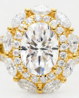 Luxury oval moissanite ring with floral halo and pavé split shank in yellow gold | SARATTI