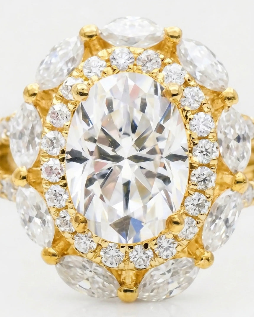 Luxury oval moissanite ring with floral halo and pavé split shank in yellow gold | SARATTI