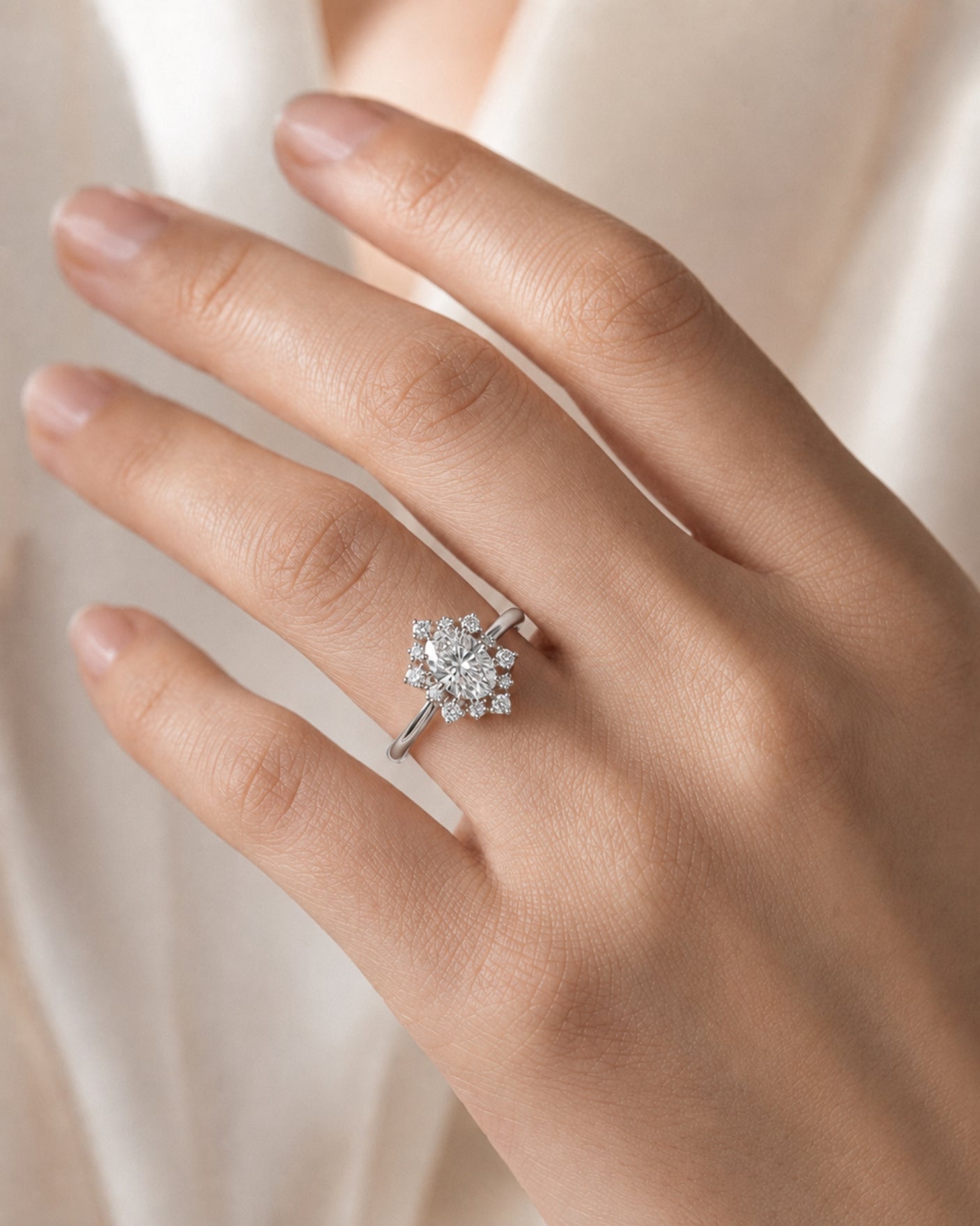 Luxury oval moissanite ring with floral halo and timeless platinum setting | SARATTI