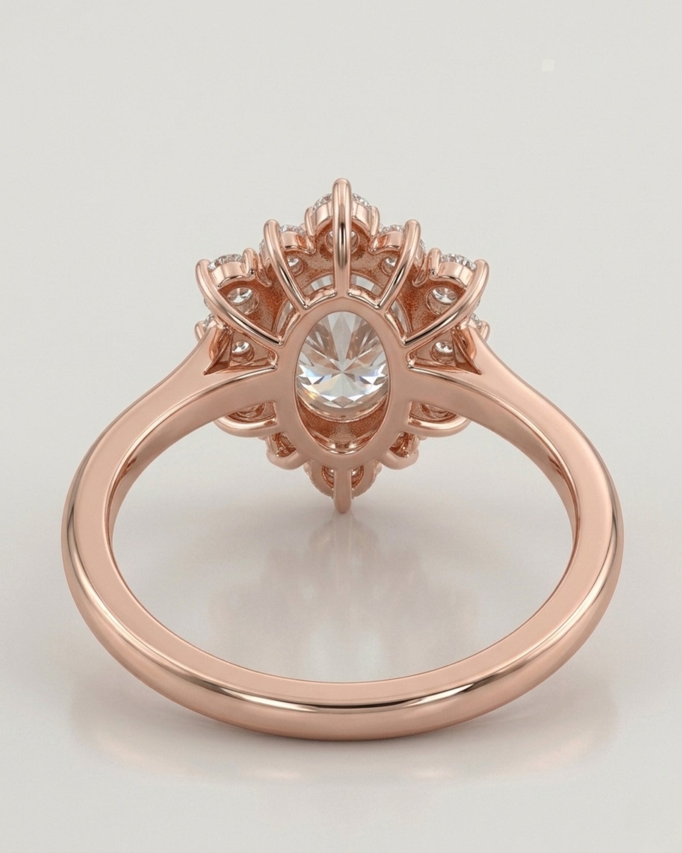 Luxury oval moissanite ring with floral halo and warm rose gold setting | SARATTI
