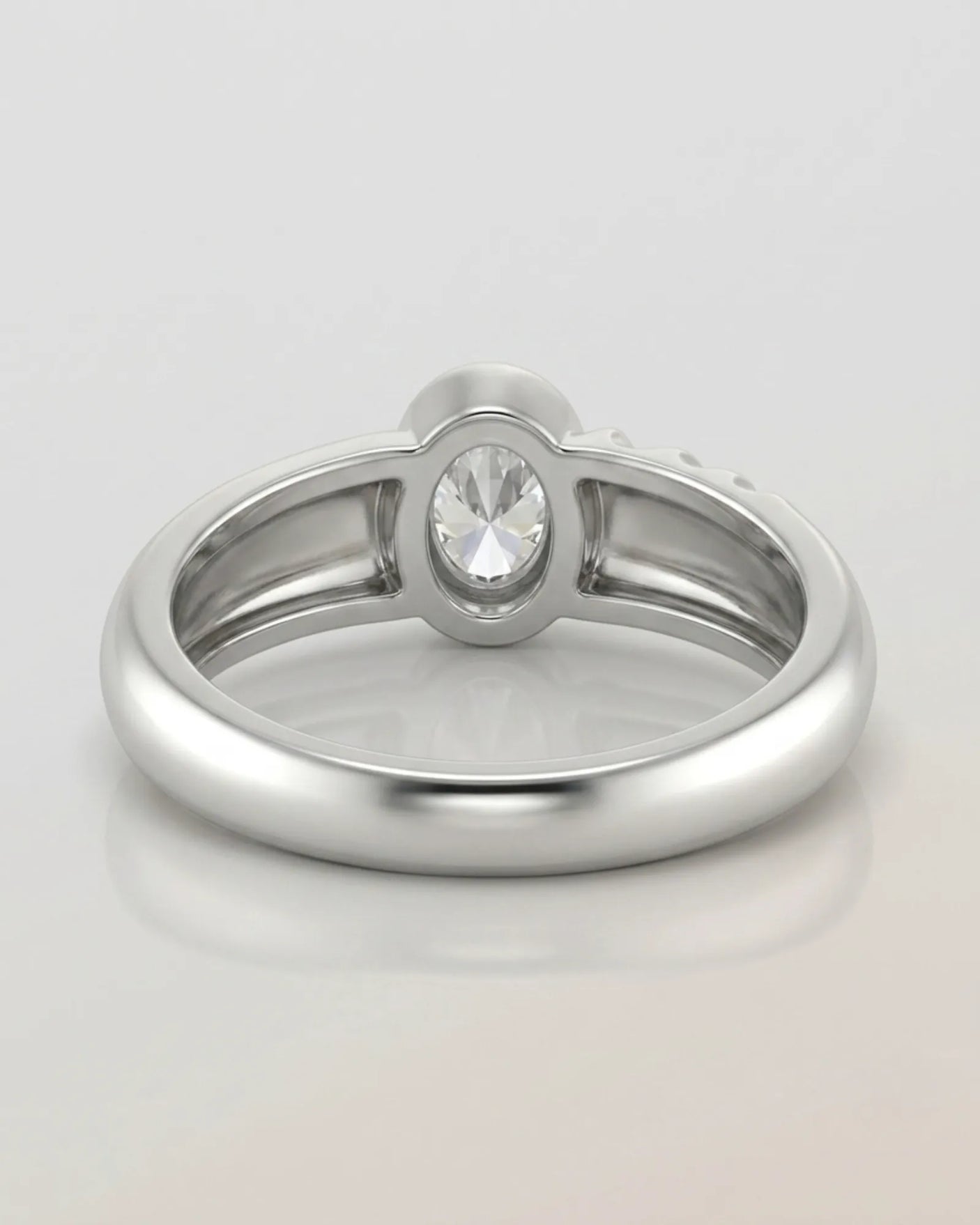 Luxury oval moissanite ring with sculptural wave band and clean white gold setting | SARATTI