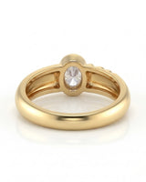 Luxury oval moissanite ring with sculptural wave band and rich yellow gold setting | SARATTI