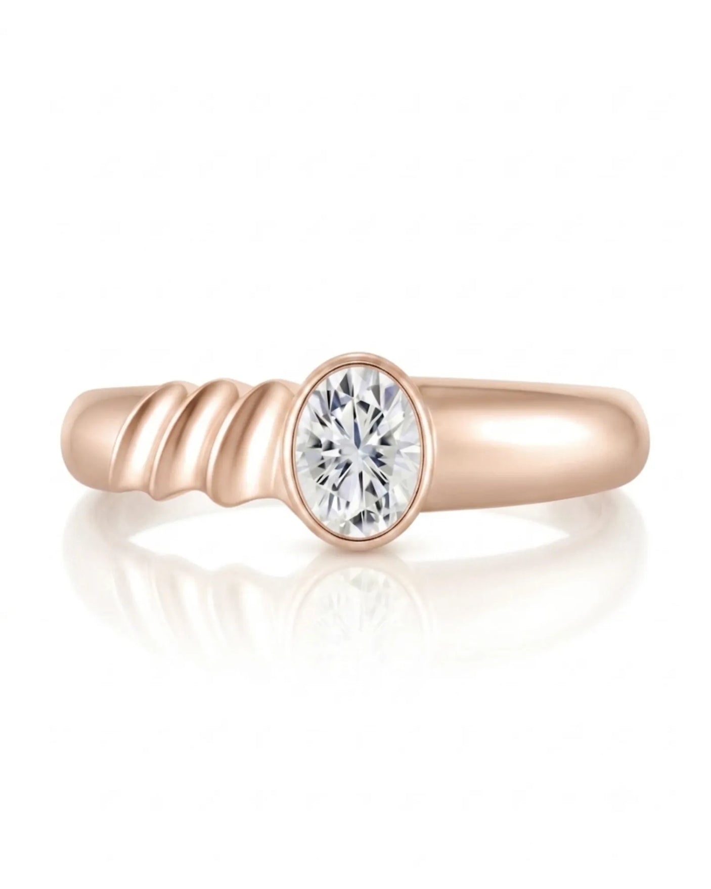 Luxury oval moissanite ring with sculptural wave band and warm rose gold setting | SARATTI