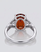 Luxury oval orange garnet ring with diamond accents in 18K white gold | SARATTI