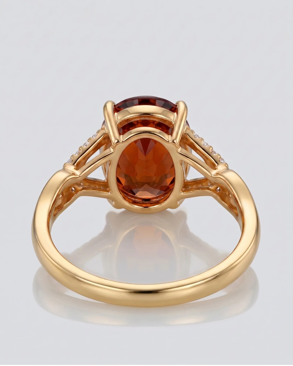 Luxury oval orange garnet ring with diamond accents in 18K yellow gold - SARATTI