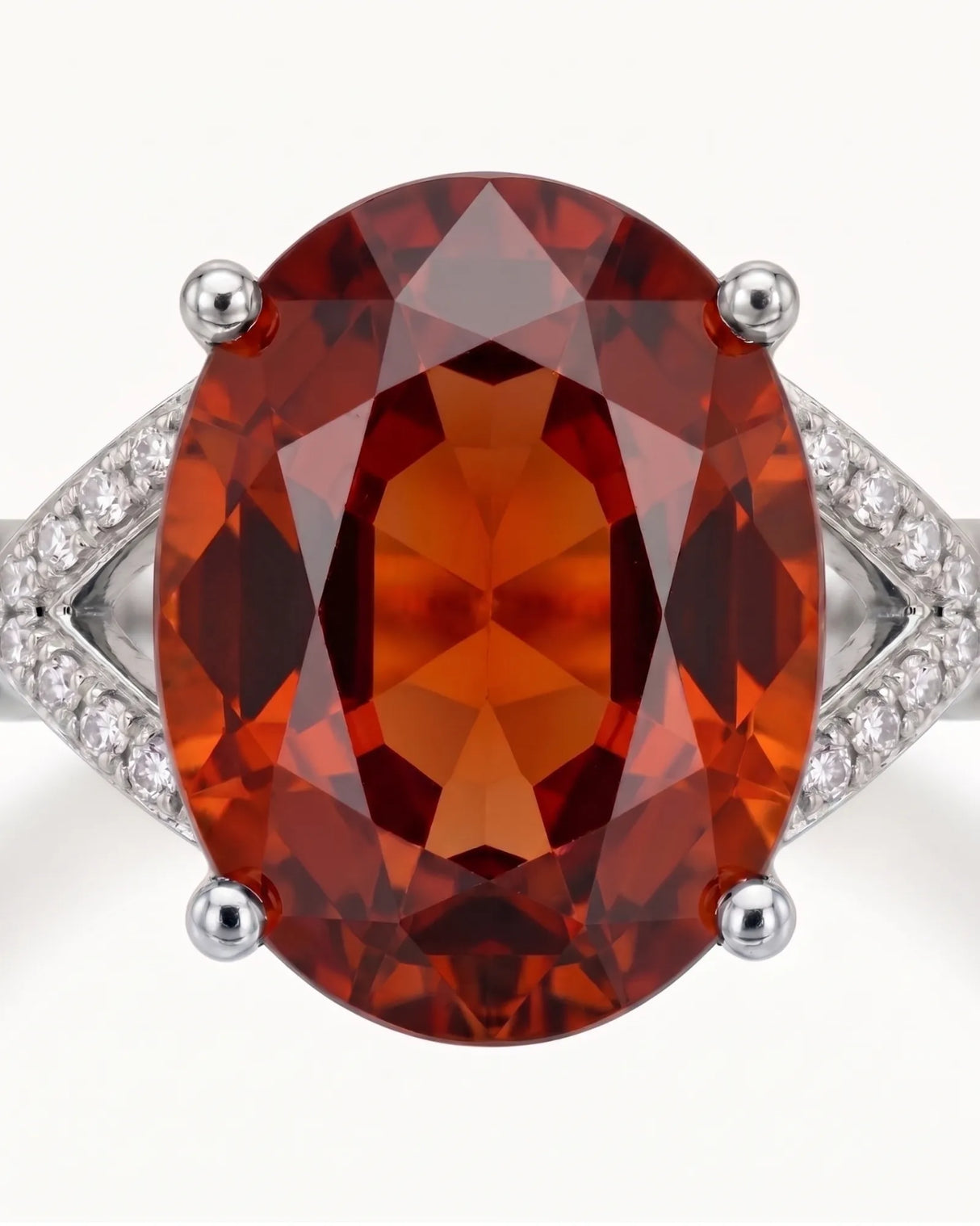 Luxury oval orange garnet ring with diamond accents in platinum | SARATTI