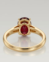 Luxury oval red garnet ring with diamond accents in 18K yellow gold - SARATTI